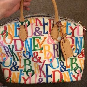 Dooney and Burke Bag. Rainbow writing on front.